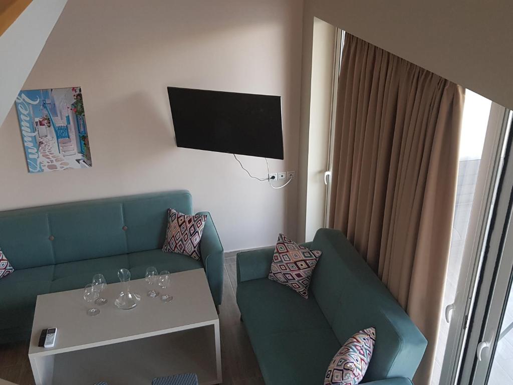 Telewizja i/lub zestaw kina domowego w obiekcie Ola Kala Apartments and Rooms