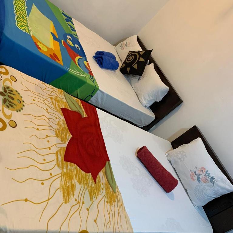 Postel nebo postele na pokoji v ubytování Marcelin Family Villa