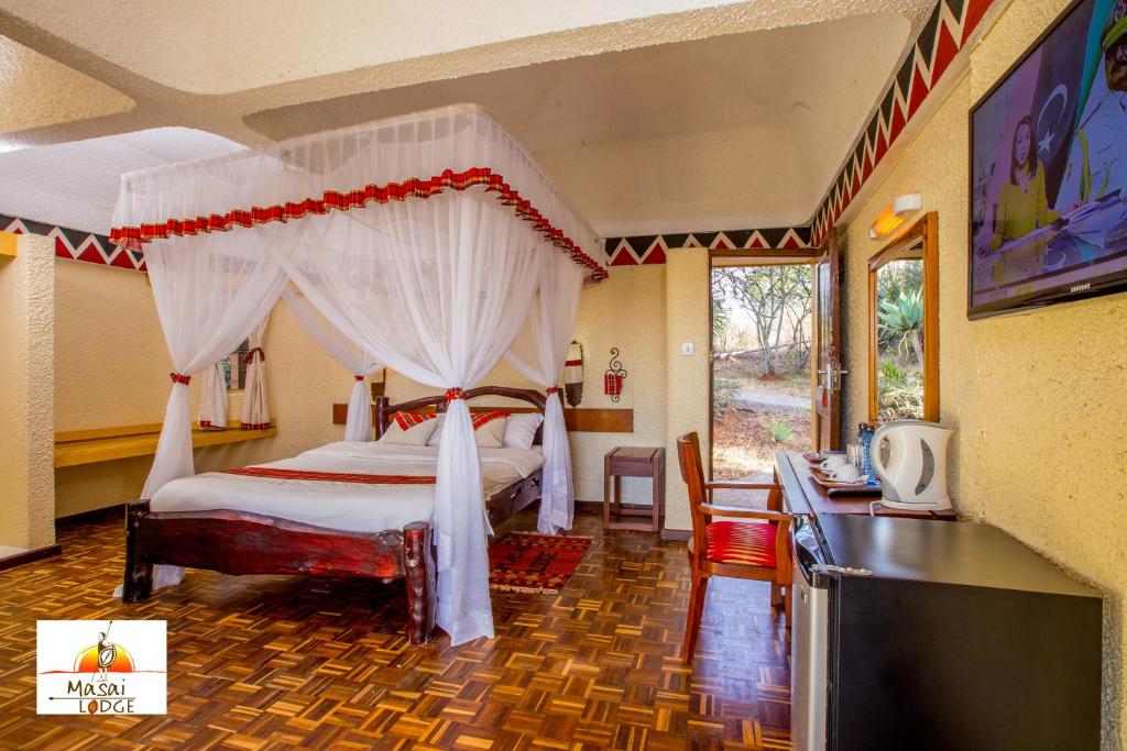 Llit o llits en una habitació de Masai Lodge