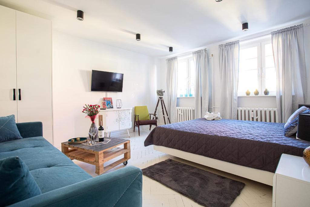 Postel nebo postele na pokoji v ubytování Republika Kopernika Apartment