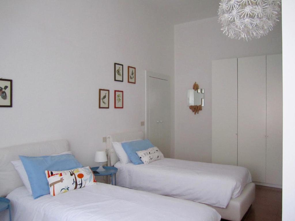 Postel nebo postele na pokoji v ubytování Le stanze di Ninni