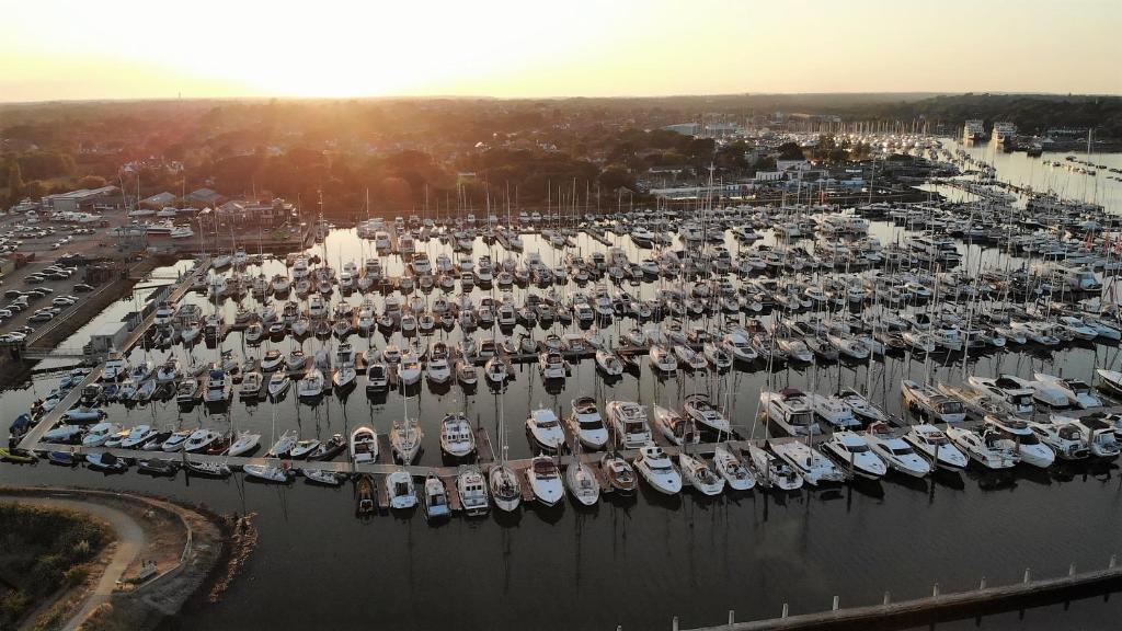 an aerial view of a marina with many boats at Mad Moment-Two Bedroom Luxury Motor Boat In Lymington in Lymington