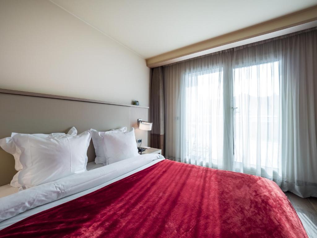 Postel nebo postele na pokoji v ubytování Hôtel Le Pré Carré