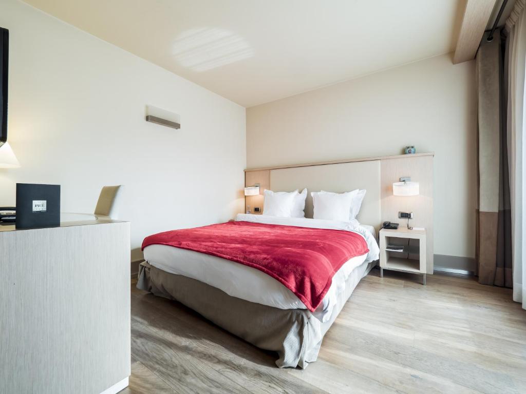 Postel nebo postele na pokoji v ubytování Hôtel Le Pré Carré
