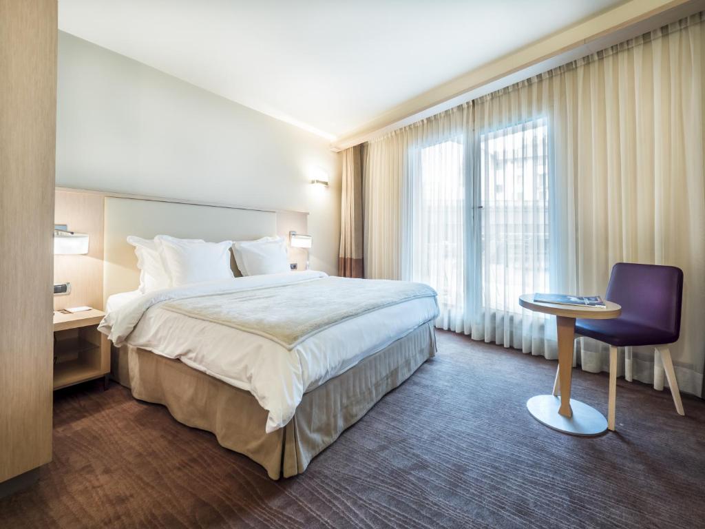 Postel nebo postele na pokoji v ubytování Hôtel Le Pré Carré