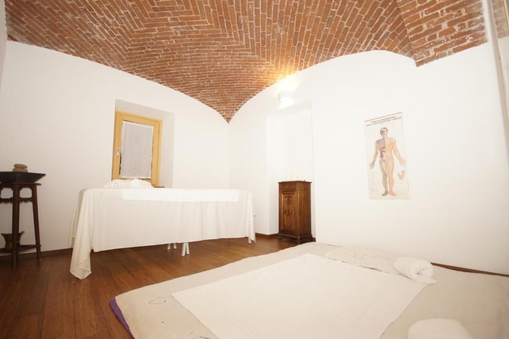 Postel nebo postele na pokoji v ubytování Cascina Bucolica B&B