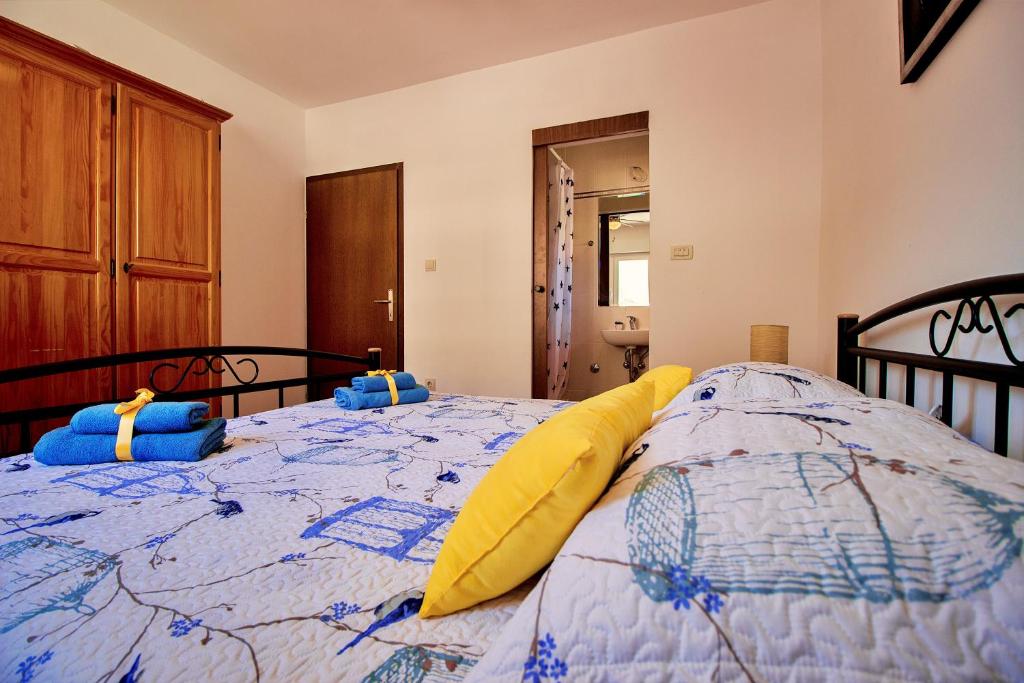 Postel nebo postele na pokoji v ubytování Sandy Beach Apartments