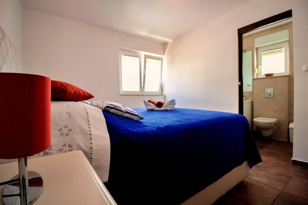 Postel nebo postele na pokoji v ubytování Sandy Beach Apartments
