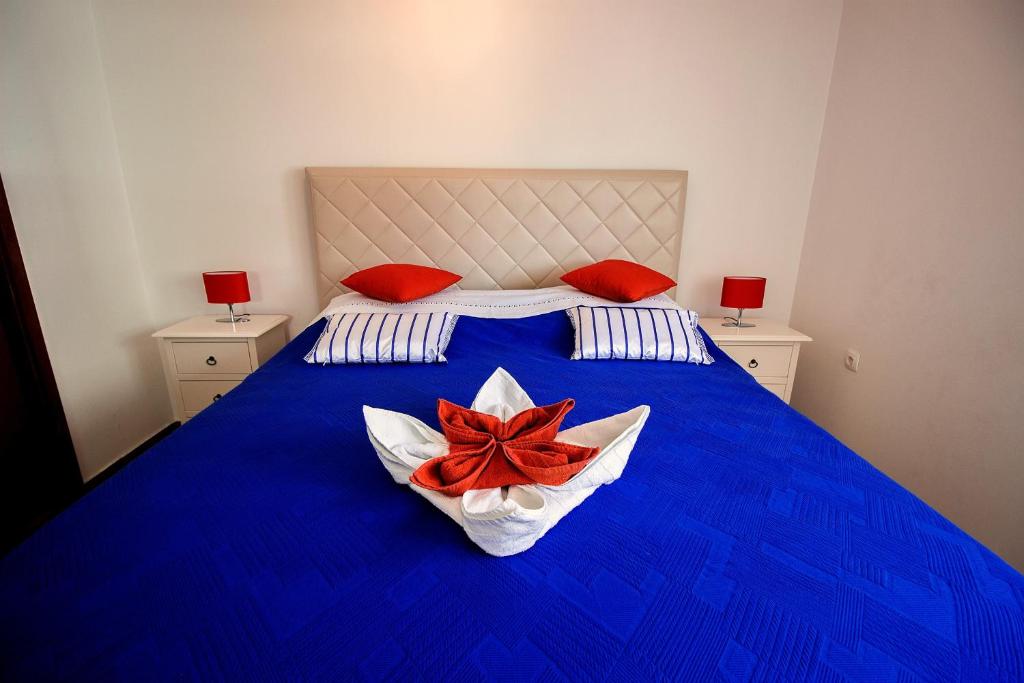 Postel nebo postele na pokoji v ubytování Sandy Beach Apartments