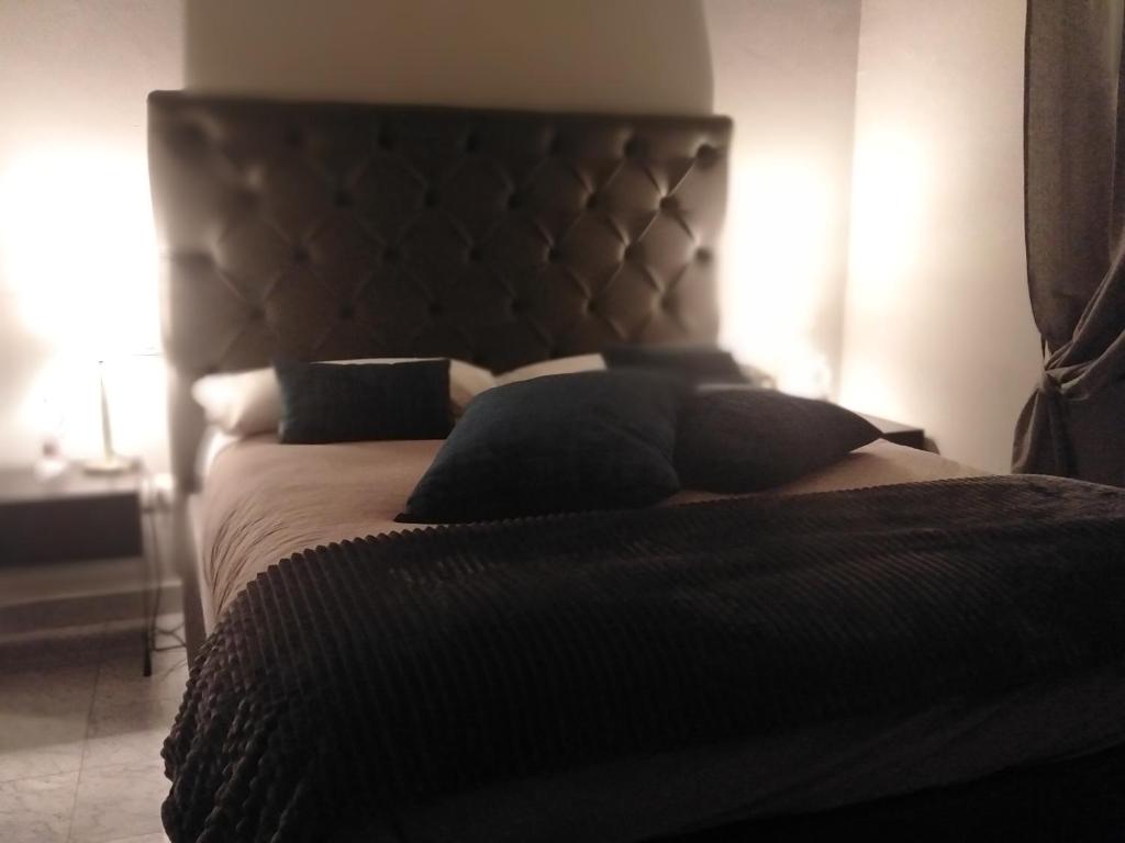 Postel nebo postele na pokoji v ubytování Compasso Suites