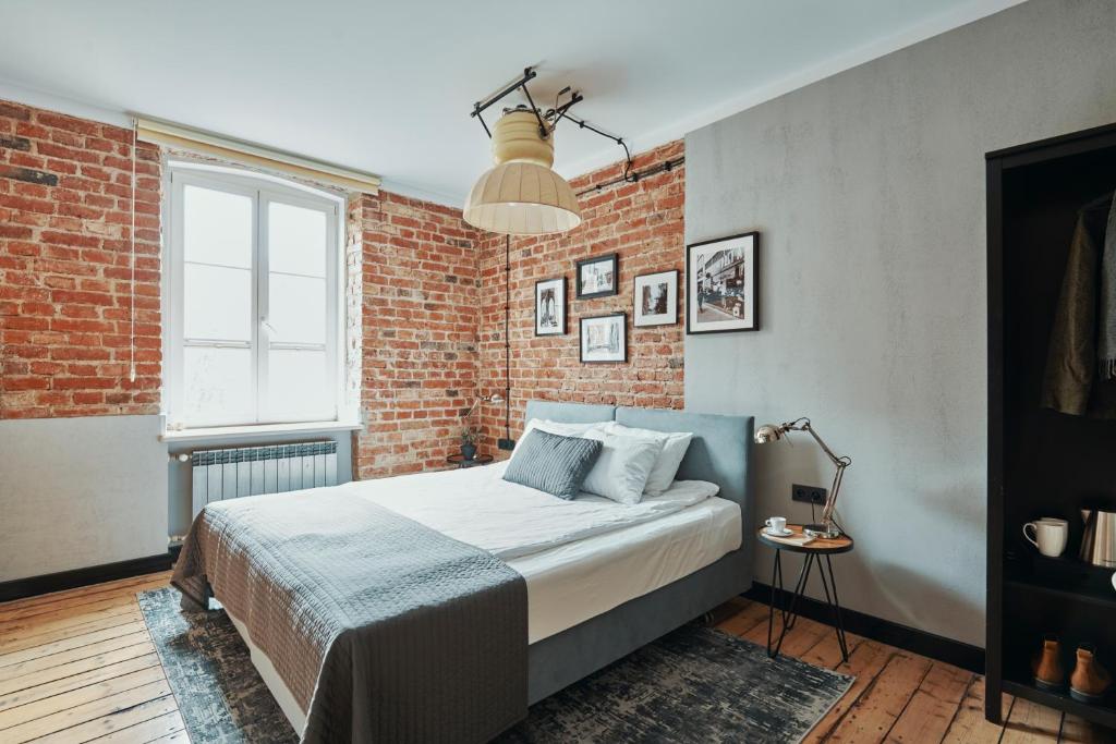 Posteľ alebo postele v izbe v ubytovaní ARTHOTEL STALOWA 52