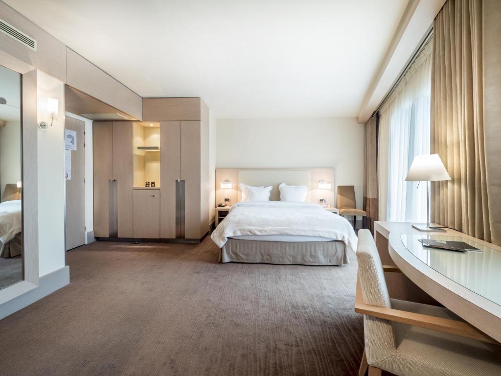 Postel nebo postele na pokoji v ubytování Hôtel Le Pré Carré