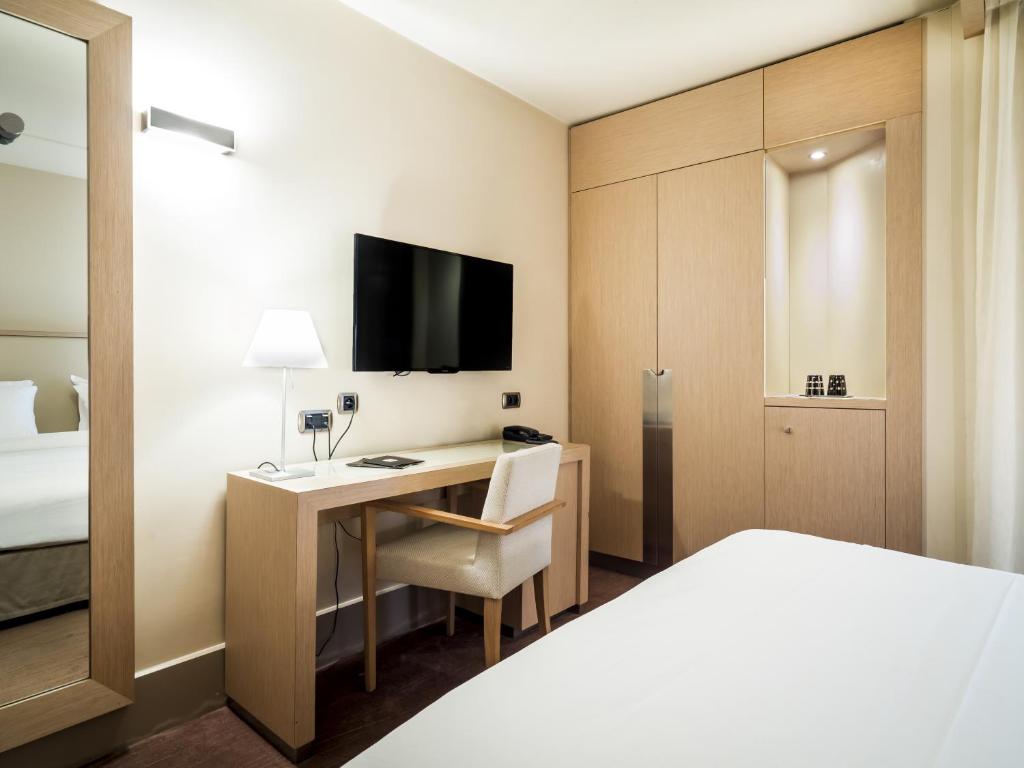 Postel nebo postele na pokoji v ubytování Hôtel Le Pré Carré