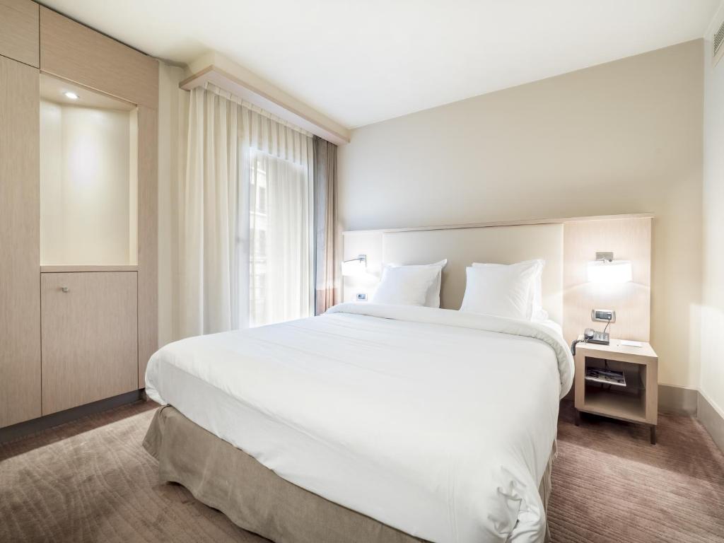 Postel nebo postele na pokoji v ubytování Hôtel Le Pré Carré