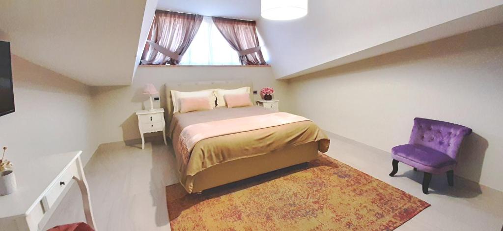 Łóżko lub łóżka w pokoju w obiekcie Villa Arya