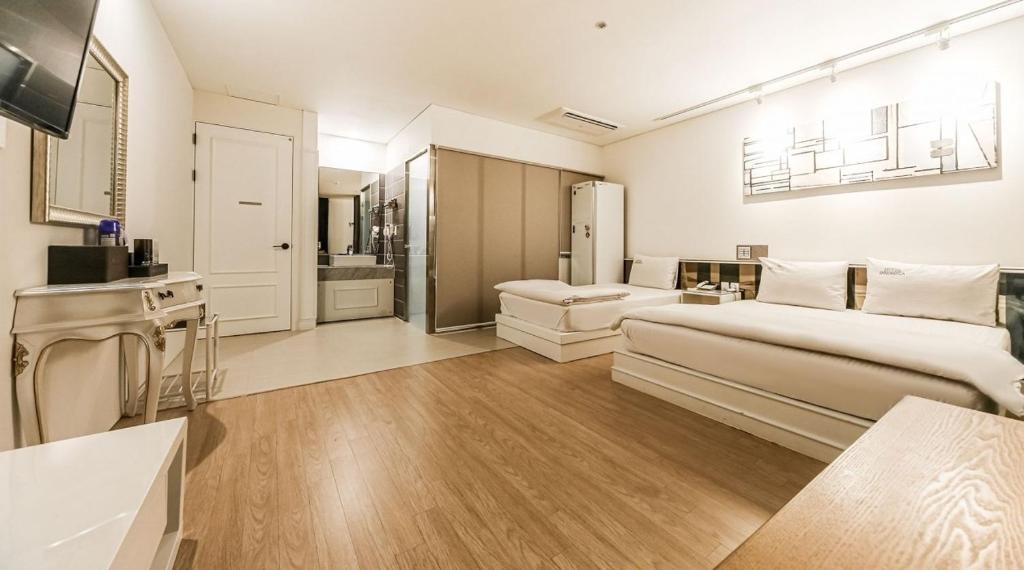 Postel nebo postele na pokoji v ubytování Hotel Insomnia