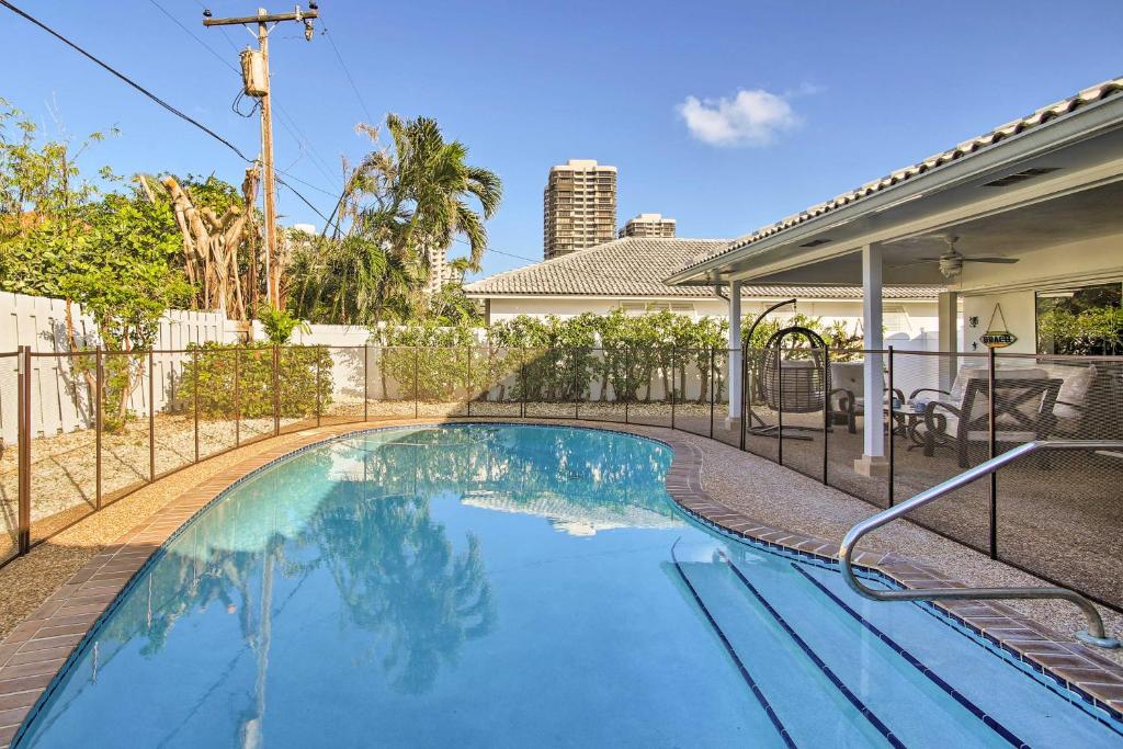 an image of a swimming pool in a house at Riviera Beach Home with Pool - Walk to Beaches! in Riviera Beach