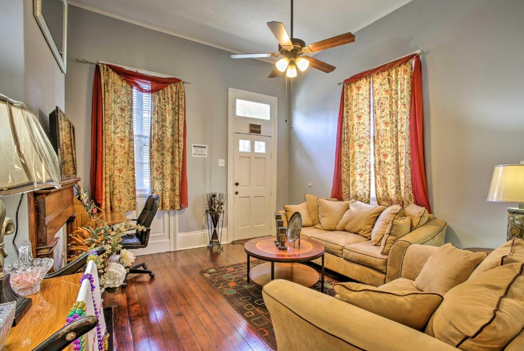 a living room with a couch and a ceiling fan at NOLA House in Irish Channel - Walk to Magazine St! in New Orleans