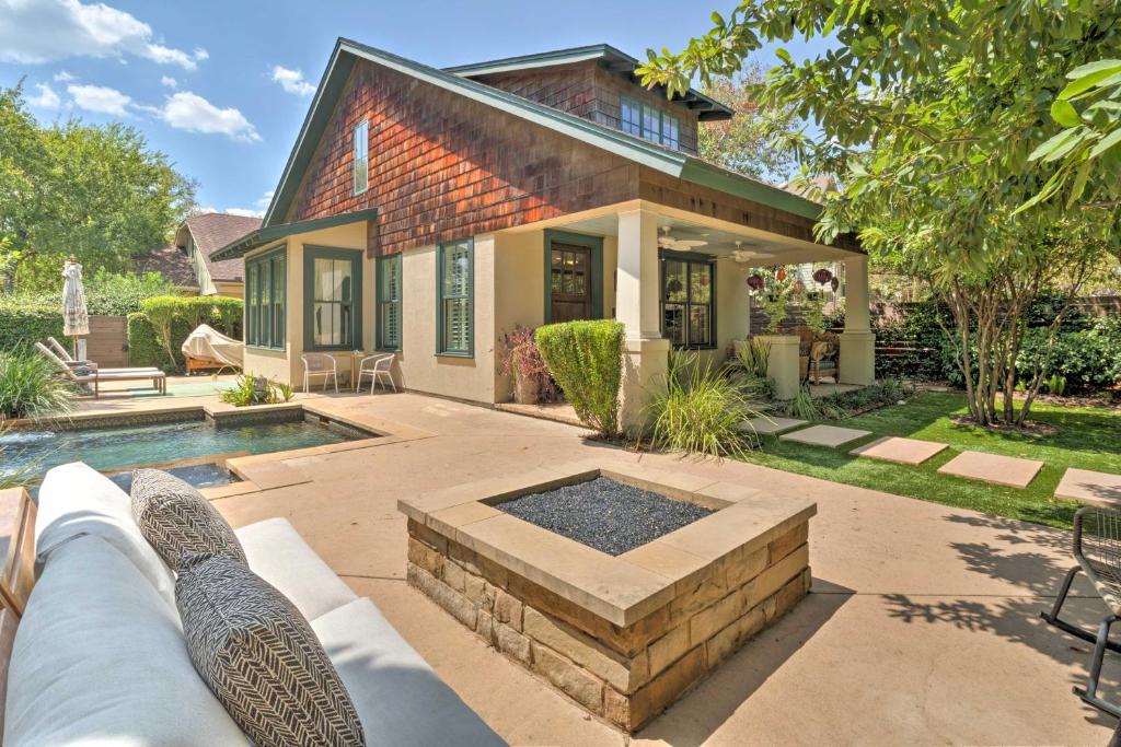 a home with a swimming pool and a house at Austin Oasis with Pool and Hot Tub - 2 Mi to Dtwn! in Austin