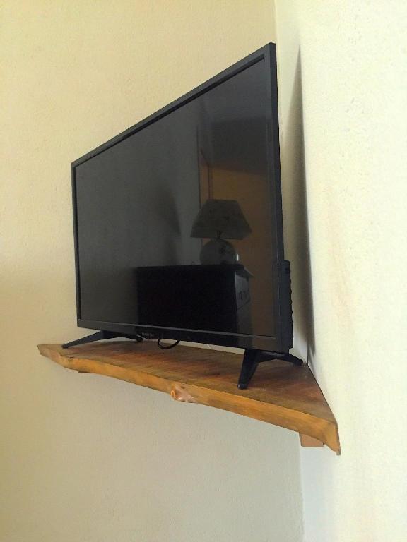 TV a/nebo společenská místnost v ubytování L'Adret