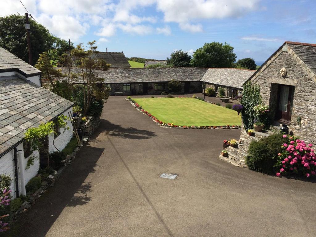 an aerial view of a house with a driveway at Courtyard Farm Cottages in Boscastle