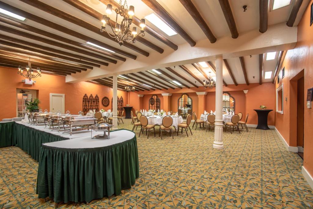 a banquet hall with tables and chairs in a room at Menger Hotel in San Antonio