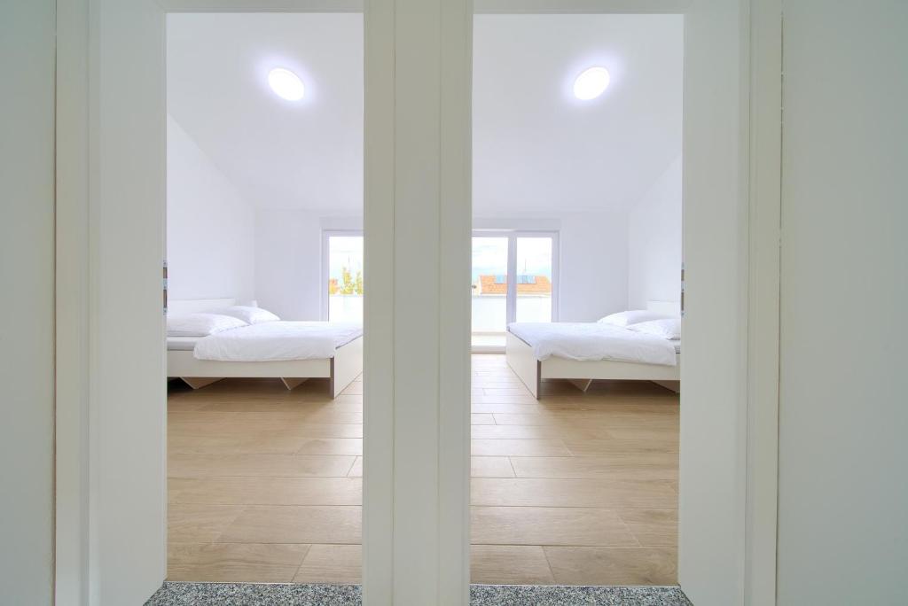 Postel nebo postele na pokoji v ubytování Adria House