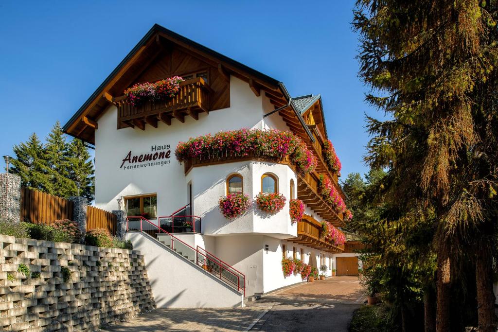 a building with flower boxes on the side of it at Haus Anemone in Serfaus