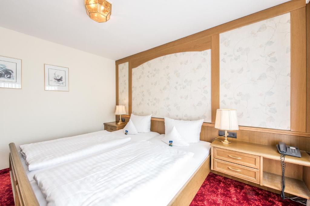 Postel nebo postele na pokoji v ubytování Hotel Hanses-Bräutigam