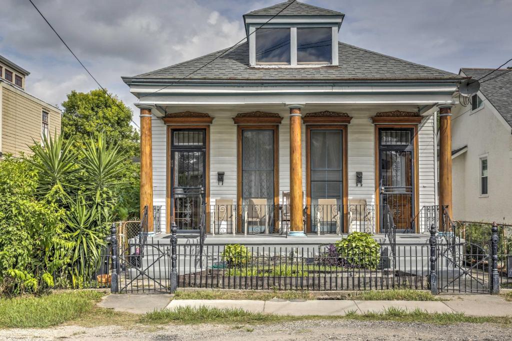 an old house with a fence in front of it at Classic New Orleans Home Near River, Zoo and Tram! in New Orleans