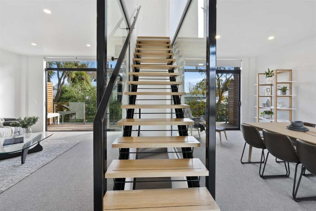 a staircase in the living room of a house at Urban Diamond in Christchurch