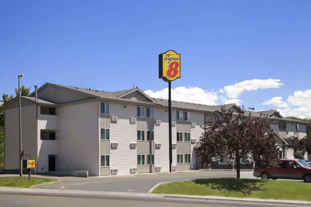 a building with a street sign in front of it at Super 8 by Wyndham Pocatello in Pocatello