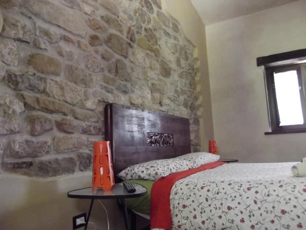 Postel nebo postele na pokoji v ubytování Borgo Lamurese