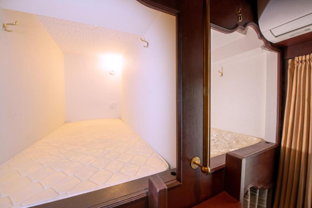 Postel nebo postele na pokoji v ubytování bnb+ Ueno Okachimachi
