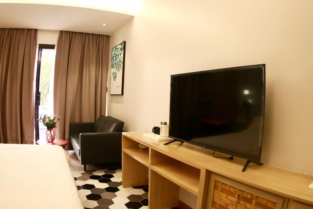TV a/nebo společenská místnost v ubytování Only Seed Resort 欧芮希度假酒店