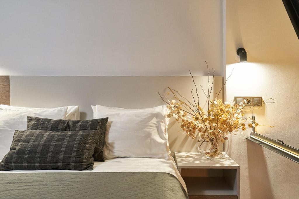 Postel nebo postele na pokoji v ubytování Deribas Hotel