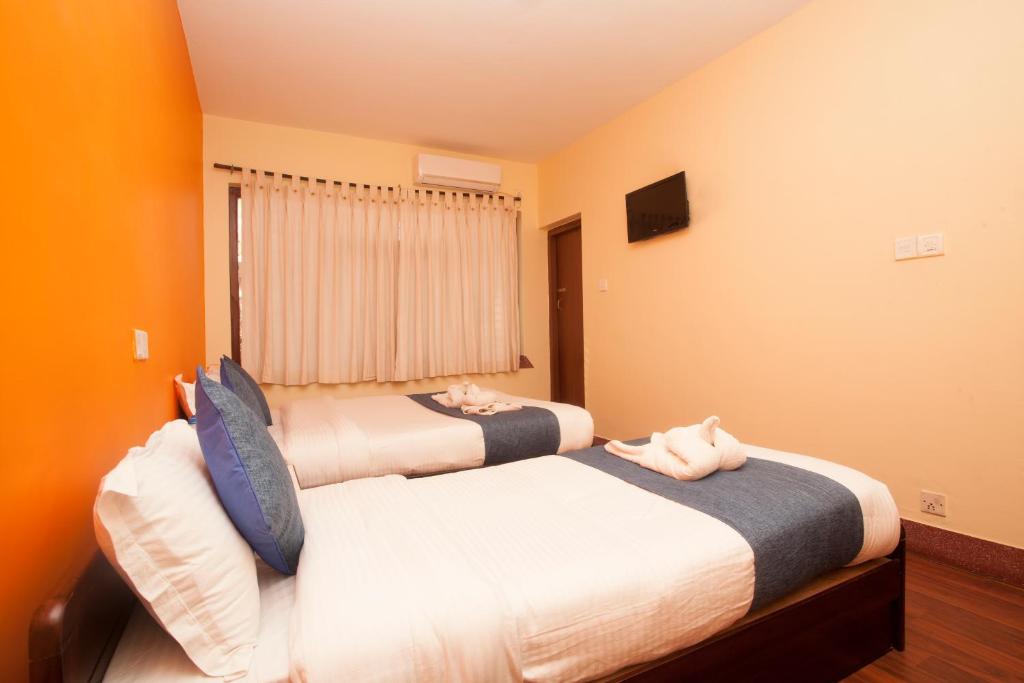 Postel nebo postele na pokoji v ubytování Hotel Green Horizon