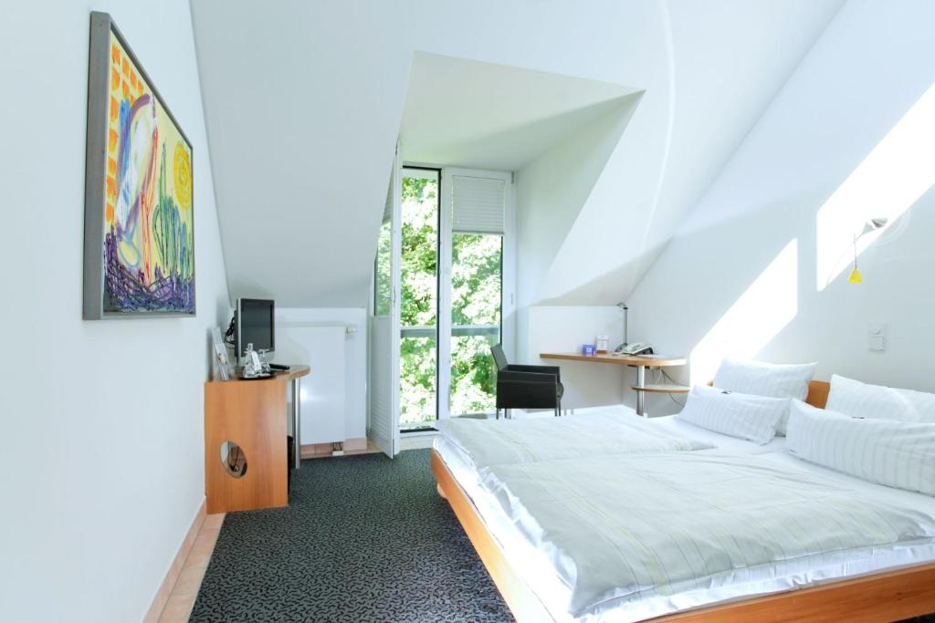 Postel nebo postele na pokoji v ubytování Hotel Watthalden