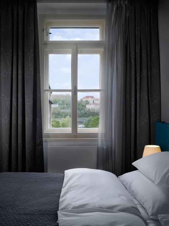 Postel nebo postele na pokoji v ubytování MOODs boutique hotel