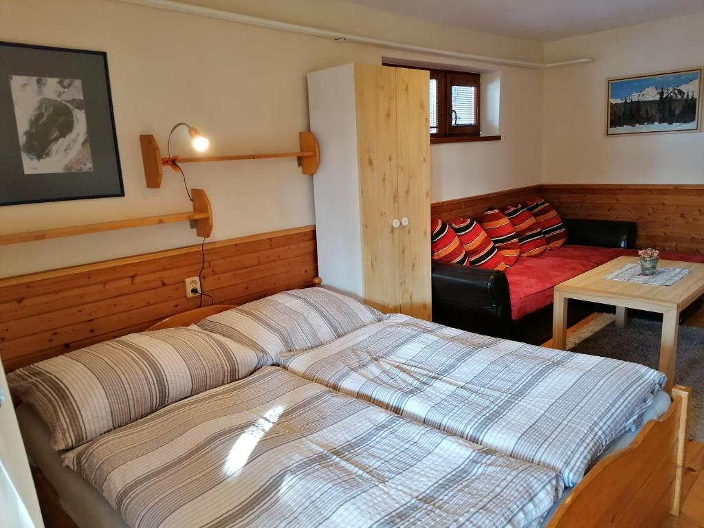 Postel nebo postele na pokoji v ubytování Family House - Apartmany Zuzana