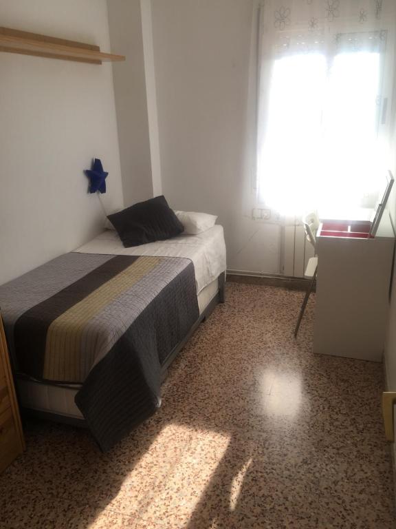 Postel nebo postele na pokoji v ubytování The Hollidays Apartment