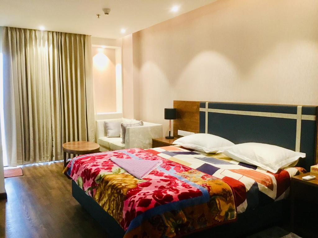 Ένα ή περισσότερα κρεβάτια σε δωμάτιο στο Dreamial Element One Studio @ Sector 47 Gurgaon