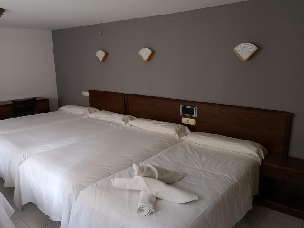 Postel nebo postele na pokoji v ubytování Ciudad de Jaca