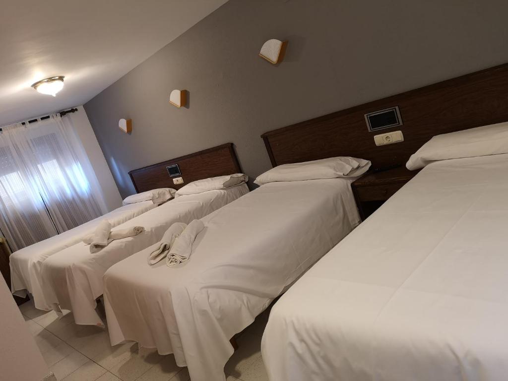 Postel nebo postele na pokoji v ubytování Ciudad de Jaca