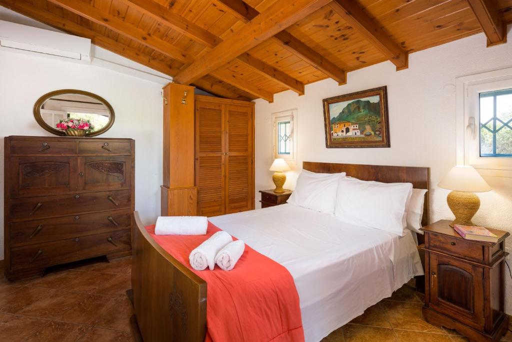Postel nebo postele na pokoji v ubytování Villa Angelos