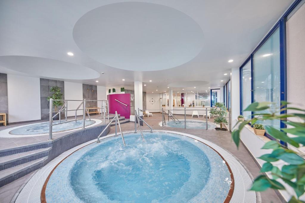 a hot tub in the middle of a building at Sandos Papagayo in Playa Blanca