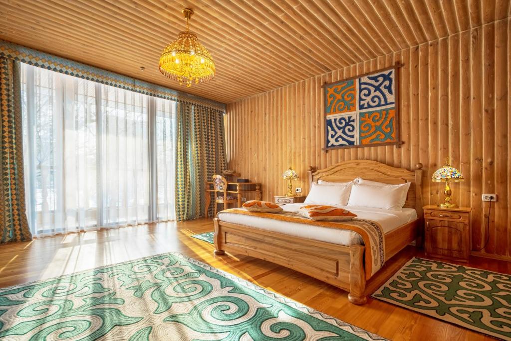 Postel nebo postele na pokoji v ubytování Navat Hotel