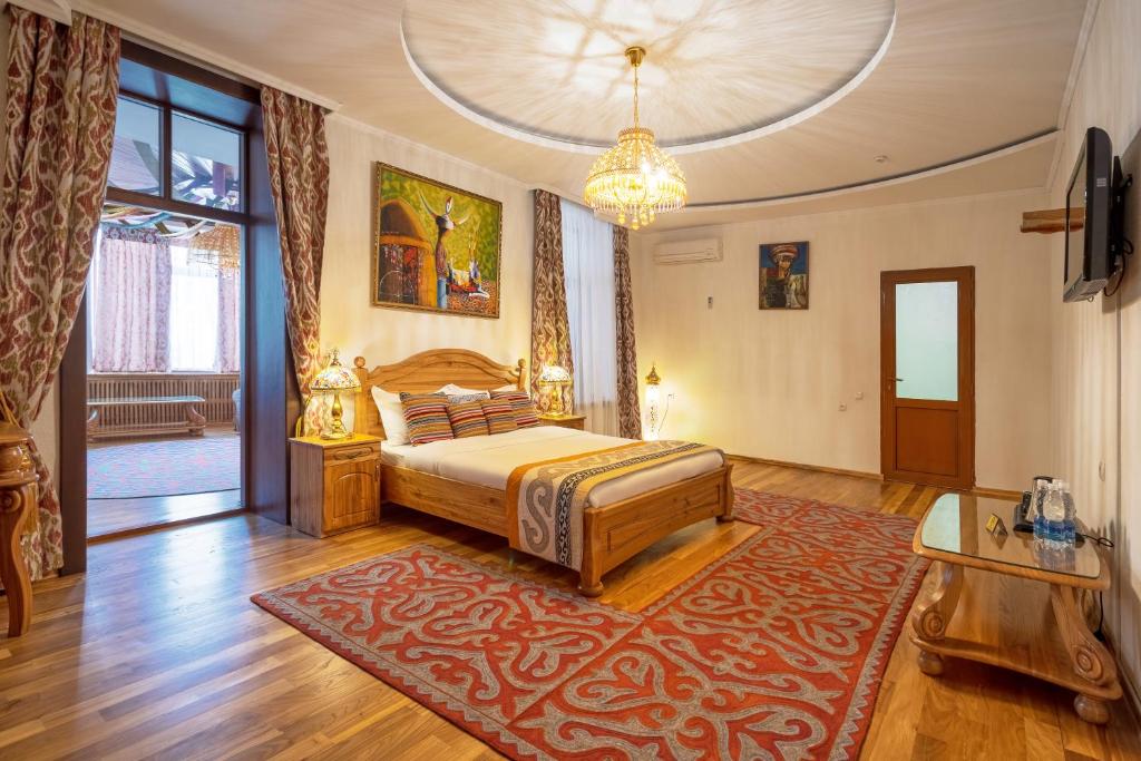 Postel nebo postele na pokoji v ubytování Navat Hotel