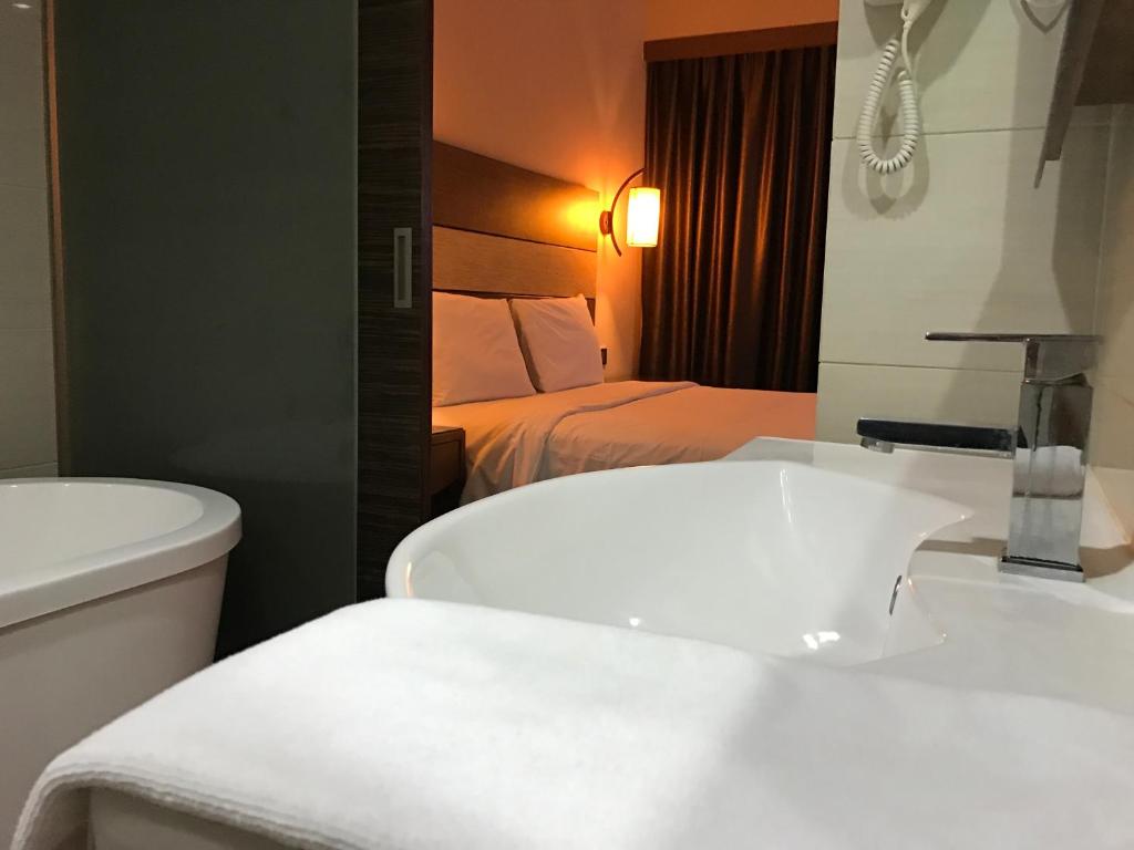 Postel nebo postele na pokoji v ubytování Sento Hotel