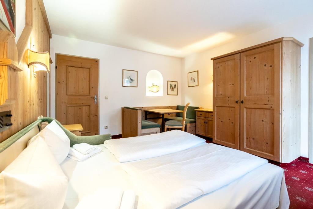 Postel nebo postele na pokoji v ubytování Hotel Hölzer Bräu by Lehmann Hotels